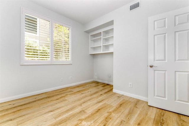 23609 Wilmington Ct, Valencia, CA 91354 - spare room with baseboards and wood finished floors