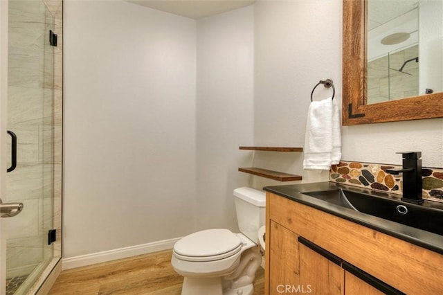 23609 Wilmington Ct, Valencia, CA 91354 - bathroom featuring a shower stall, vanity, and wood finished floors