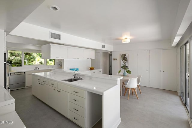 3505 E California Blvd, Pasadena, CA 91107 - kitchen featuring stainless steel dishwasher, light countertops, and white cabinetry