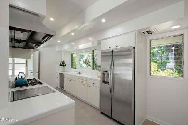 3505 E California Blvd, Pasadena, CA 91107 - kitchen featuring appliances with stainless steel finishes, island range hood, white cabinetry, light countertops, and recessed lighting