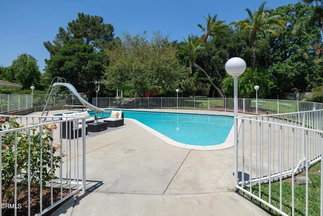 3505 E California Blvd, Pasadena, CA 91107 - view of swimming pool featuring a water slide, a patio area, and view of wooded area