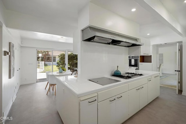 3505 E California Blvd, Pasadena, CA 91107 - kitchen with black appliances, white cabinetry, light countertops, recessed lighting, and wall chimney exhaust hood