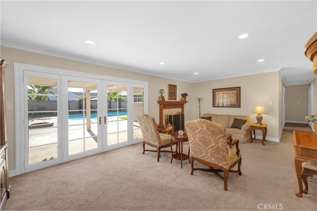 12111 Reagan St, Los Alamitos, CA 90720 - living room featuring french doors, light colored carpet, recessed lighting, and ornamental molding
