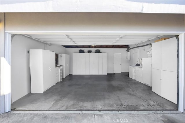 12111 Reagan St, Los Alamitos, CA 90720 - garage featuring washing machine and clothes dryer