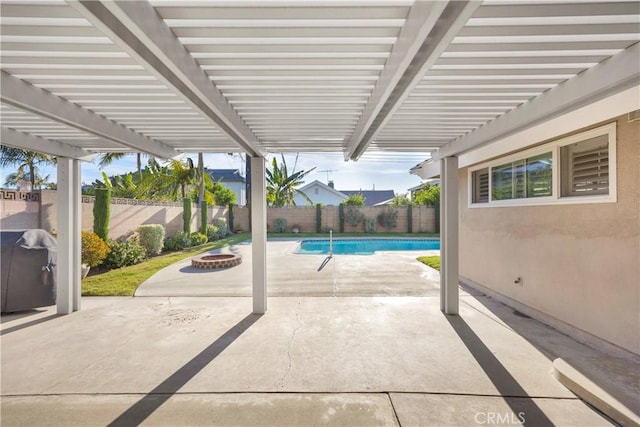 12111 Reagan St, Los Alamitos, CA 90720 - fenced backyard featuring an outdoor fire pit, a patio area, and a pergola