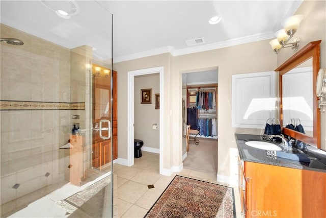12111 Reagan St, Los Alamitos, CA 90720 - full bathroom featuring a stall shower, vanity, tile patterned flooring, ornamental molding, and a spacious closet