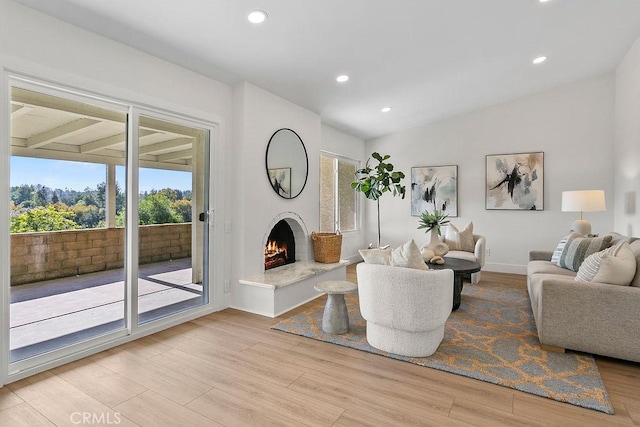 23631 Via Storni, Mission Viejo, CA 92692 - living area with healthy amount of natural light, light wood-style floors, recessed lighting, and a warm lit fireplace