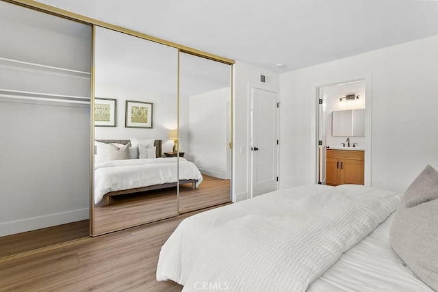 23631 Via Storni, Mission Viejo, CA 92692 - bedroom with a closet, light wood-type flooring, and connected bathroom