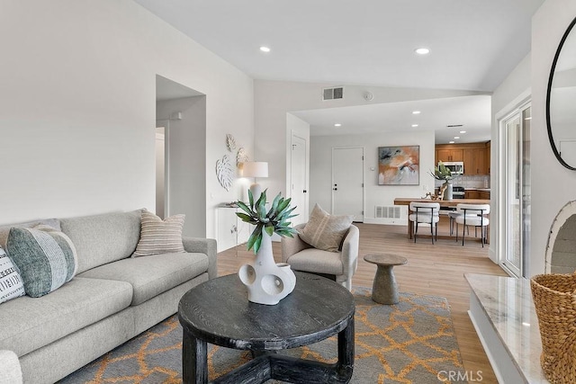 23631 Via Storni, Mission Viejo, CA 92692 - living area featuring wood finished floors, vaulted ceiling, and recessed lighting