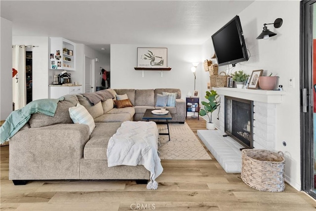 139 Flag Way Unit C, Paso Robles, CA 93446 - living area with a fireplace and wood finished floors
