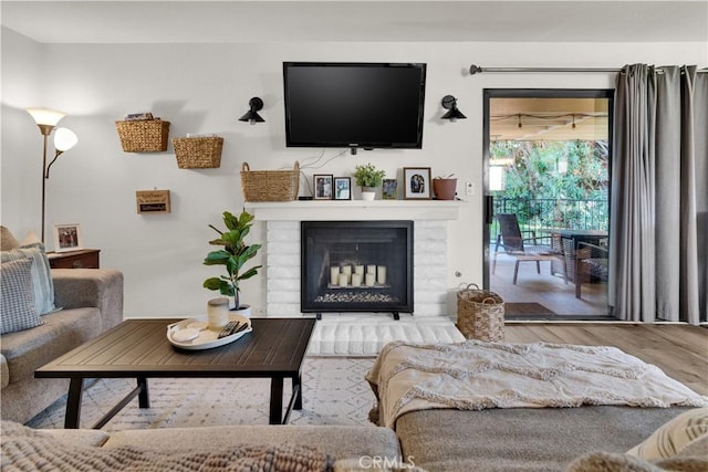 139 Flag Way Unit C, Paso Robles, CA 93446 - living room featuring wood finished floors and a brick fireplace