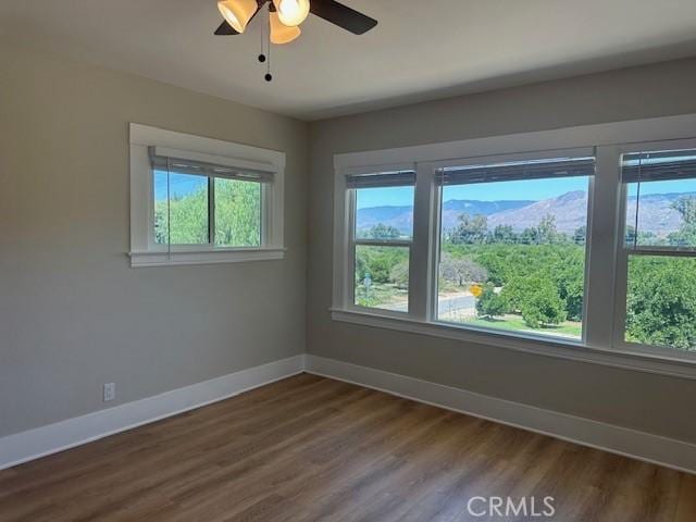 1902 E Citrus Ave, Redlands, CA 92374 - unfurnished room featuring dark wood-type flooring and a ceiling fan