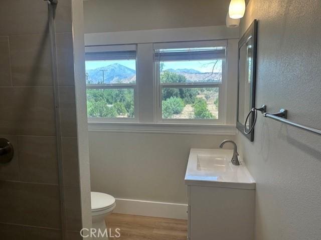 1902 E Citrus Ave, Redlands, CA 92374 - full bathroom featuring vanity, a shower, and wood finished floors