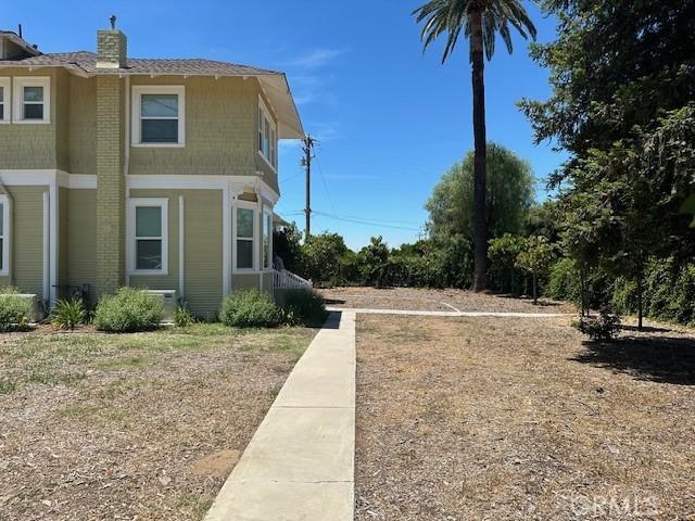 1902 E Citrus Ave, Redlands, CA 92374 - view of property exterior featuring a chimney and brick siding
