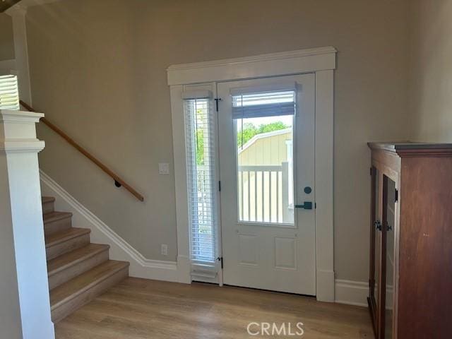 1902 E Citrus Ave, Redlands, CA 92374 - entryway with light wood finished floors and stairs