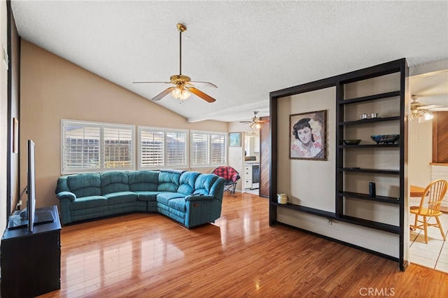 932 Redwood Ct, Corona, CA 92879 - living room featuring ceiling fan, a textured ceiling, wood finished floors, and vaulted ceiling