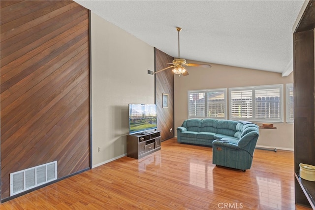 932 Redwood Ct, Corona, CA 92879 - living room featuring ceiling fan, wood finished floors, vaulted ceiling, and a textured ceiling