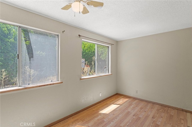 932 Redwood Ct, Corona, CA 92879 - unfurnished room with wood finished floors, a textured ceiling, and ceiling fan