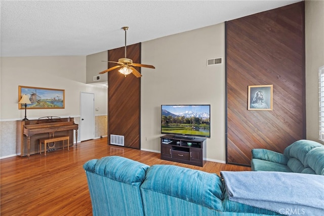 932 Redwood Ct, Corona, CA 92879 - living area with ceiling fan, wood finished floors, high vaulted ceiling, and a textured ceiling