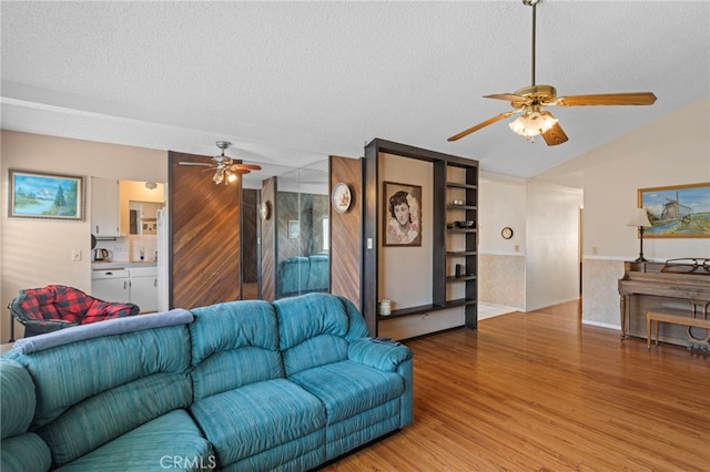 932 Redwood Ct, Corona, CA 92879 - living area with a ceiling fan, a textured ceiling, light wood-style floors, and lofted ceiling