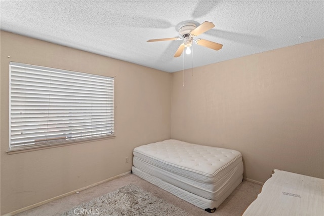 932 Redwood Ct, Corona, CA 92879 - carpeted bedroom featuring multiple windows, ceiling fan, and a textured ceiling