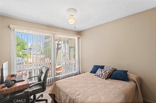 932 Redwood Ct, Corona, CA 92879 - bedroom featuring a textured ceiling and a desk