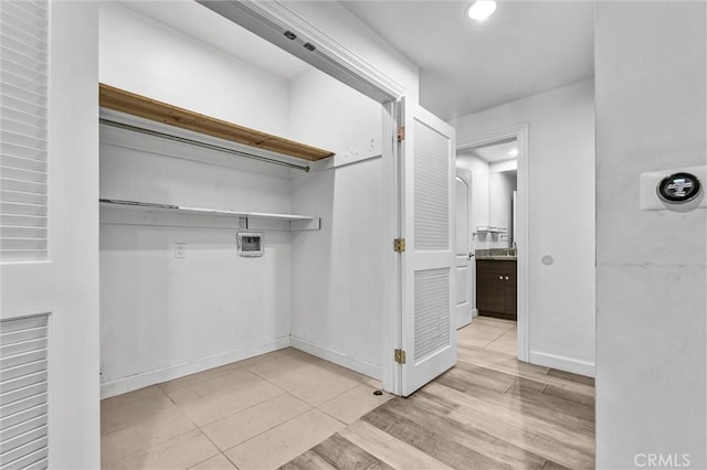 991 Arapahoe St Unit 202A, Los Angeles, CA 90006 - laundry room with washer hookup, light tile patterned flooring, and recessed lighting