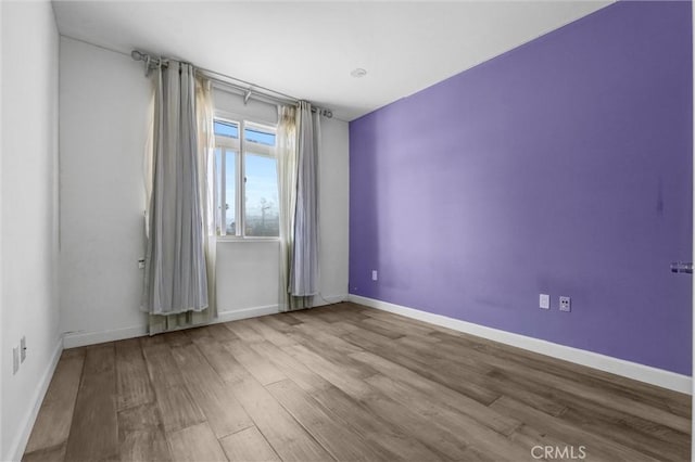 991 Arapahoe St Unit 202A, Los Angeles, CA 90006 - spare room featuring wood finished floors and baseboards