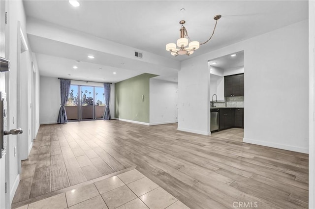 991 Arapahoe St Unit 202A, Los Angeles, CA 90006 - unfurnished living room with a chandelier, light wood-style floors, and recessed lighting