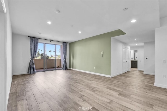 991 Arapahoe St Unit 202A, Los Angeles, CA 90006 - empty room featuring light wood-style flooring and recessed lighting