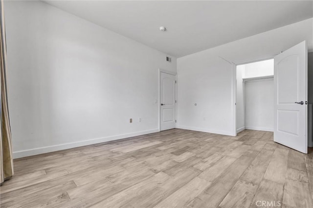 991 Arapahoe St Unit 202A, Los Angeles, CA 90006 - unfurnished bedroom with light wood finished floors and a closet
