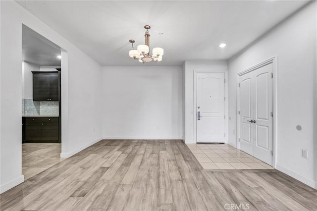 991 Arapahoe St Unit 202A, Los Angeles, CA 90006 - unfurnished dining area with a chandelier, wood finished floors, and recessed lighting
