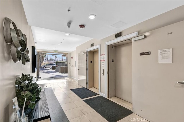 991 Arapahoe St Unit 202A, Los Angeles, CA 90006 - hallway with elevator, light tile patterned floors, and recessed lighting