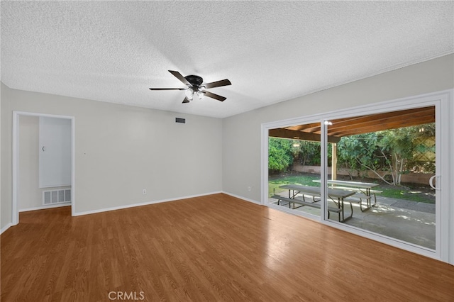 10802 Jordan Rd, Whittier, CA 90603 - spare room with wood finished floors, ceiling fan, and a textured ceiling