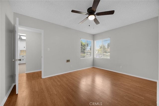 10802 Jordan Rd, Whittier, CA 90603 - spare room featuring wood finished floors, ceiling fan, and a textured ceiling