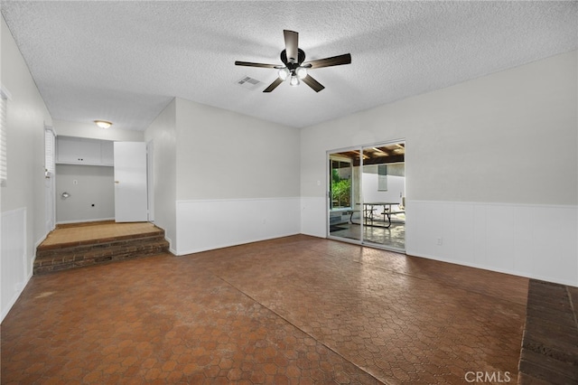 10802 Jordan Rd, Whittier, CA 90603 - unfurnished room with ceiling fan, a textured ceiling, and wainscoting