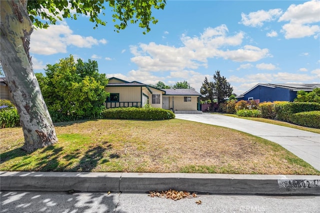 10802 Jordan Rd, Whittier, CA 90603 - view of front of home featuring driveway and a front yard