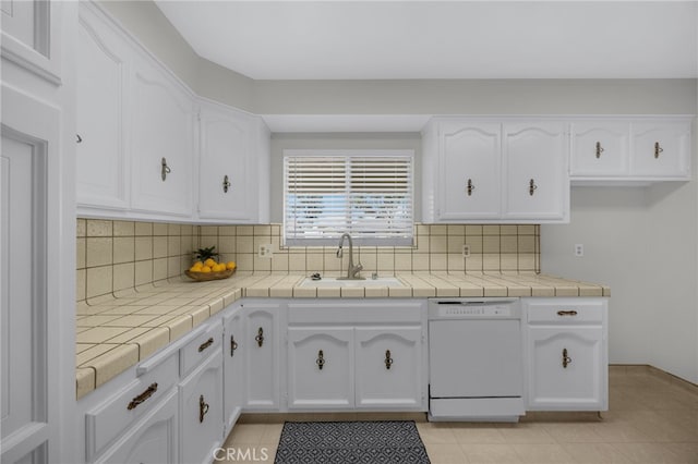 10802 Jordan Rd, Whittier, CA 90603 - kitchen with dishwasher, white cabinetry, decorative backsplash, and tile counters