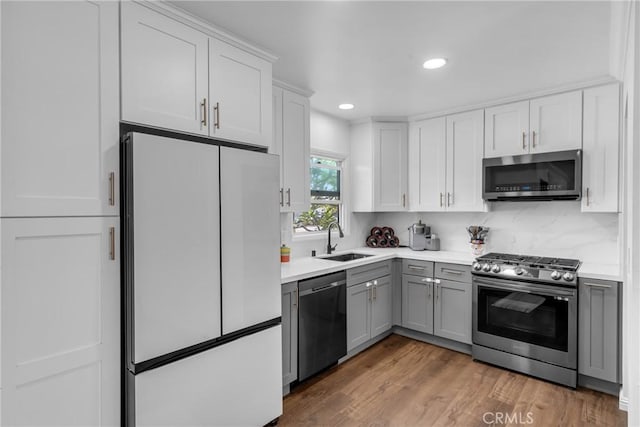 7503 Norwalk Blvd, Whittier, CA 90606 - kitchen featuring stainless steel appliances, gray cabinets, light countertops, recessed lighting, and white cabinetry