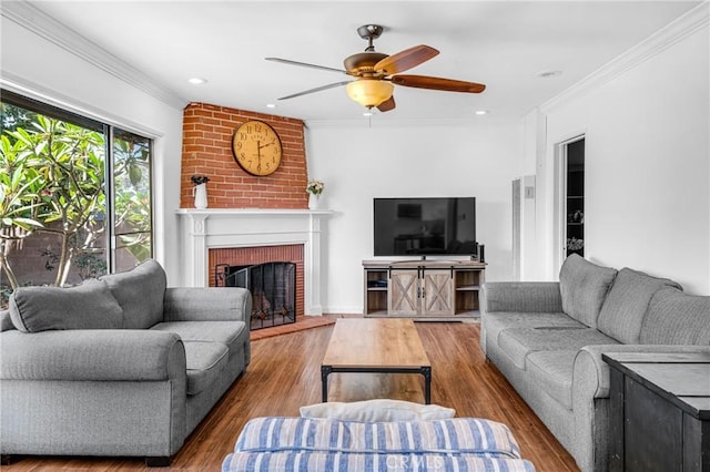 7503 Norwalk Blvd, Whittier, CA 90606 - living room with crown molding, a ceiling fan, a brick fireplace, and wood finished floors