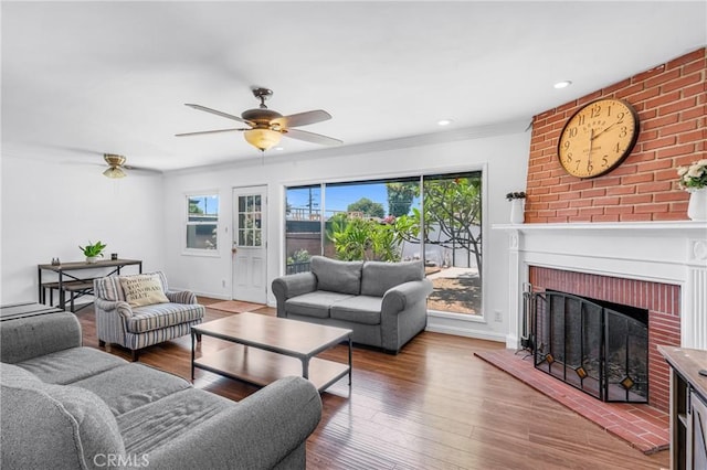 7503 Norwalk Blvd, Whittier, CA 90606 - living area with healthy amount of natural light, a ceiling fan, wood finished floors, a fireplace, and ornamental molding