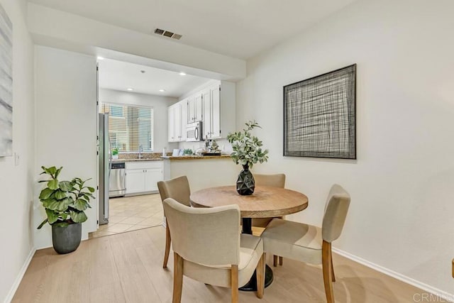 1131 Elfin Forest Rd E, San Marcos, CA 92078 - dining space featuring light wood-type flooring and recessed lighting