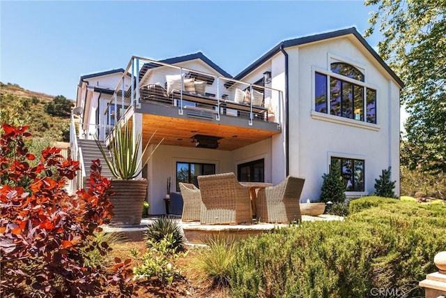 769 Greystone Pl, San Luis Obispo, CA 93401 - back of property with stucco siding, a balcony, stairway, and a patio area