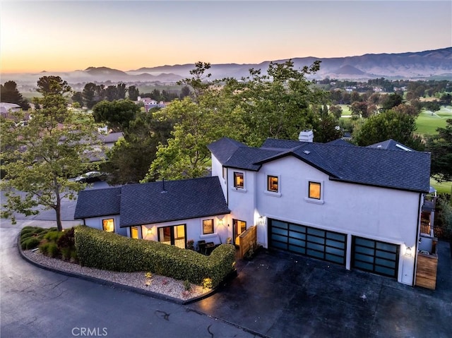 769 Greystone Pl, San Luis Obispo, CA 93401 - view of front facade with a garage, driveway, a mountain view, and roof with shingles