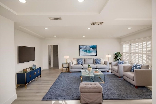 13132 Stanrich Pl, Garden Grove, CA 92843 - living room featuring light wood finished floors, recessed lighting, and a tray ceiling