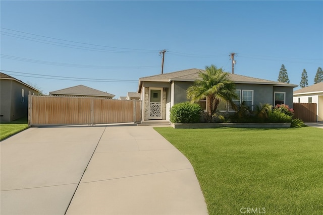 13132 Stanrich Pl, Garden Grove, CA 92843 - view of front of property featuring stucco siding, driveway, and a gate