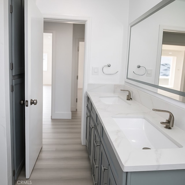 13132 Stanrich Pl, Garden Grove, CA 92843 - bathroom featuring double vanity and wood finished floors
