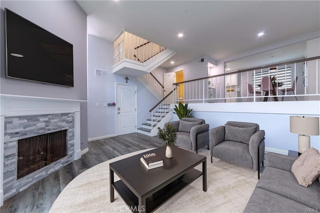 9000 Vanalden Ave Unit 176, Northridge, CA 91324 - living room featuring wood finished floors, stairs, a tile fireplace, and recessed lighting