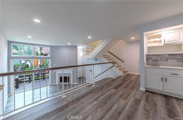 9000 Vanalden Ave Unit 176, Northridge, CA 91324 - hall featuring wood finished floors, stairway, and recessed lighting