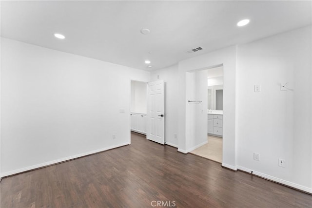 456 W Linden Dr, Orange, CA 92865 - unfurnished bedroom featuring dark wood-style floors, recessed lighting, and connected bathroom